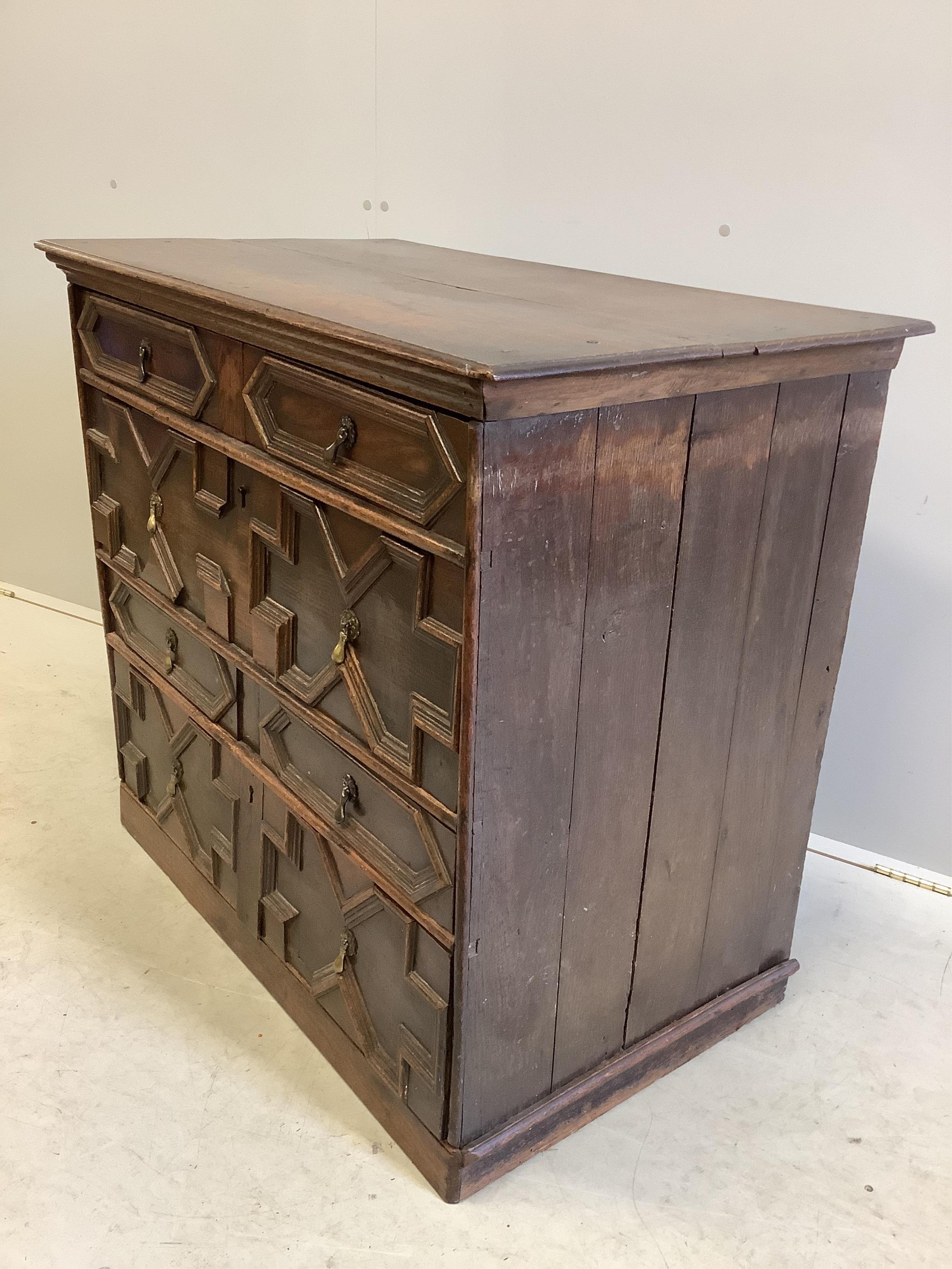 An 18th century geometric moulded oak chest, width 95cm, depth 54cm, height 86cm. Condition - fair